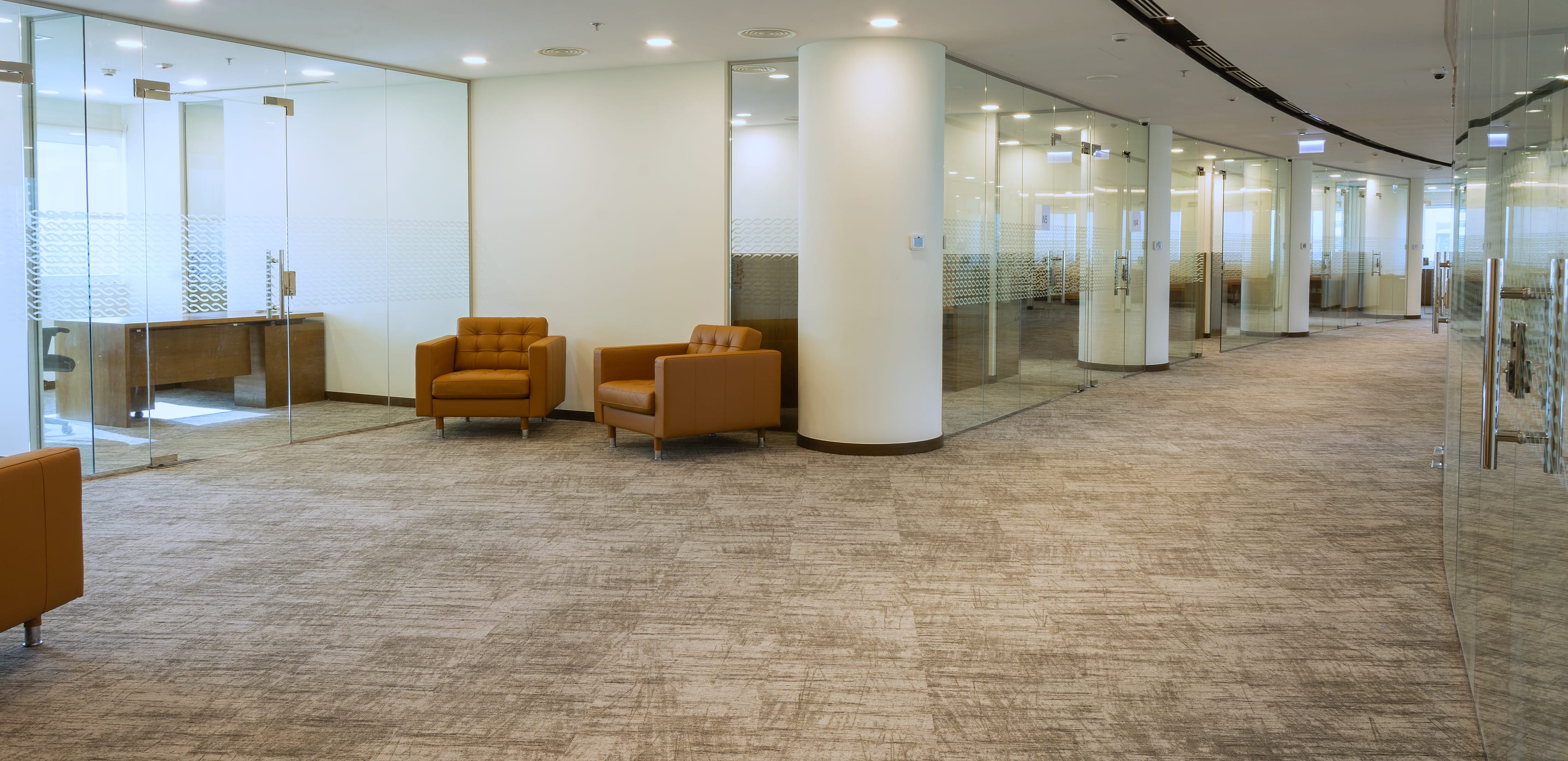 Office interior with patterned glass partitions